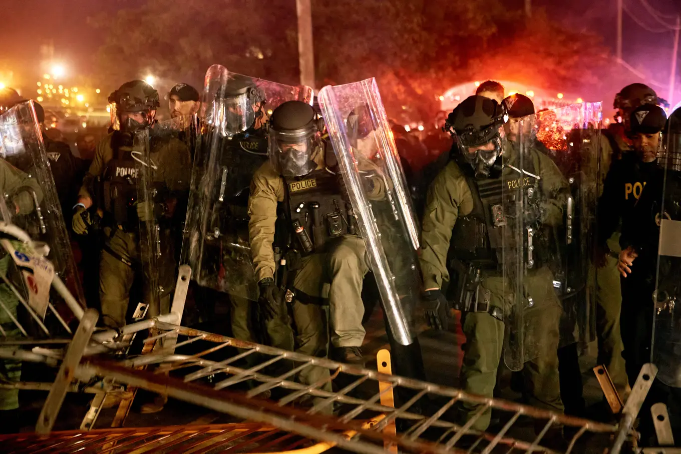 Police in riot gear face off against crowd at Delaney Hall ICE detention center riot-police-new-jersey-may-30.webp